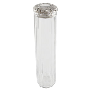 A Victorian, faceted glass jar with a silver lid.