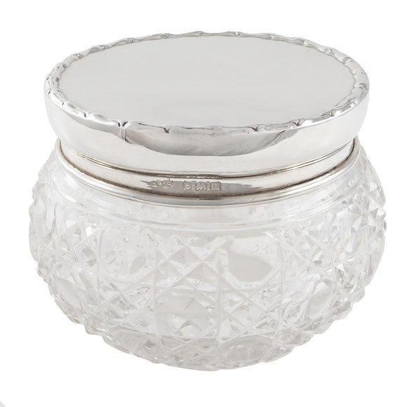 An Edwardian, glass jar with a silver lid