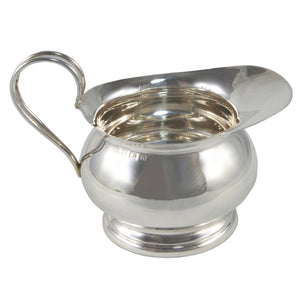 A mid-20th century, silver cream jug