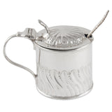 An Edwardian, silver, drum mustard pot & spoon & a blue glass liner.