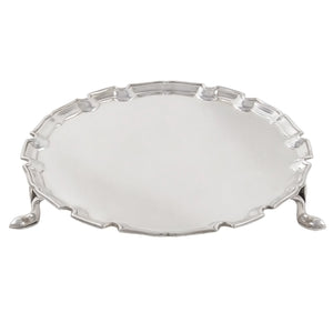 An early 20th century, silver, circular card tray on three feet