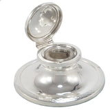 An early 20th century, silver Capstan inkwell with a clear glass liner