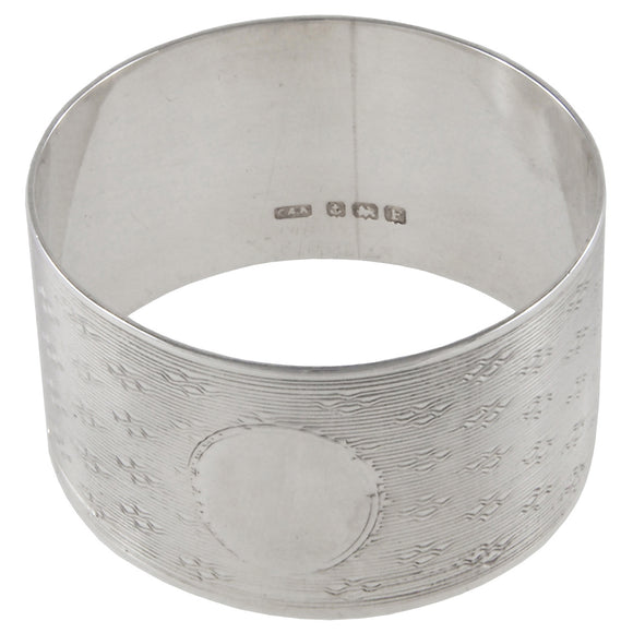 An early 20th century, silver, engine turned napkin ring