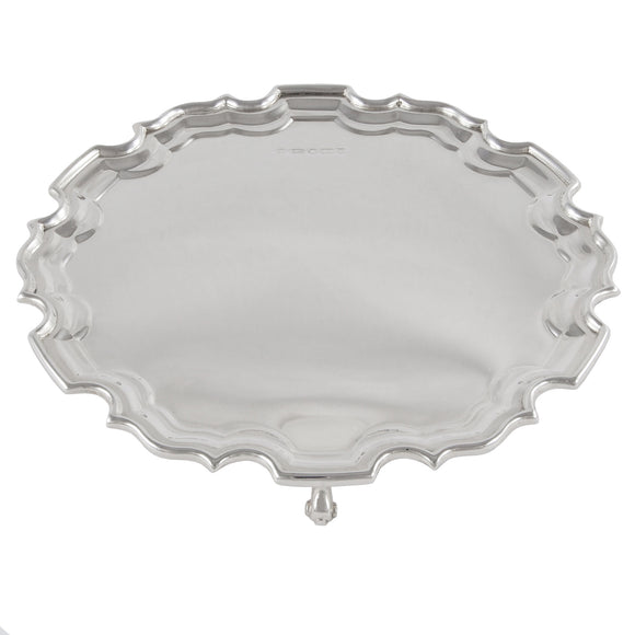 An Edwardian, silver, circular card tray on three feet