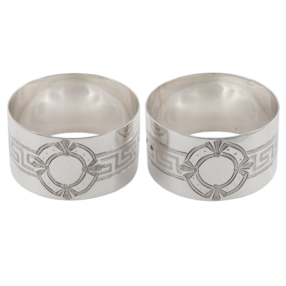 A pair of Victorian, silver, engraved napkin rings