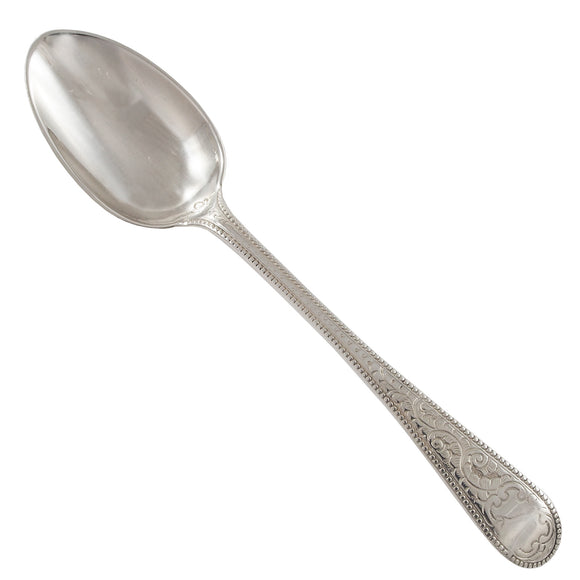 A Victorian, silver teaspoon with an engraved handle