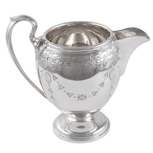 An early 20th century, silver, engraved cream jug