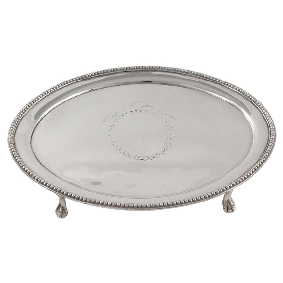 An Georgian, silver, oval teapot stand on four feet