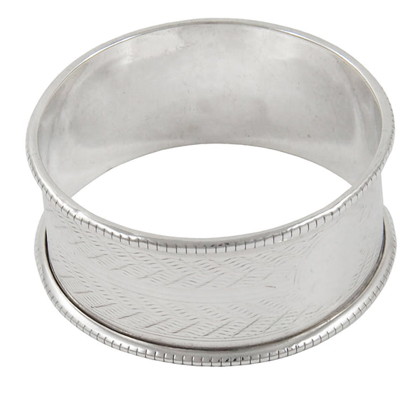 An early 20th century, silver, engine turned napkin ring