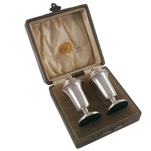 A pair of Edwardian, silver salt & pepper pots & fitted case