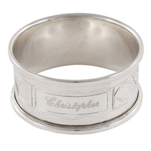 A modern, silver napkin ring engraved with the name Christopher