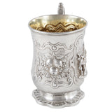 A Victorian, silver tankard with a figure in relief of a person & fruit