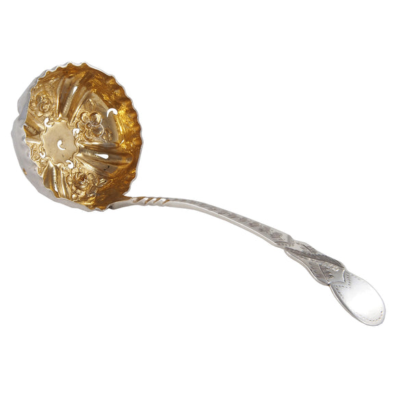 A Victorian, silver sifter spoon with a gilded bowl