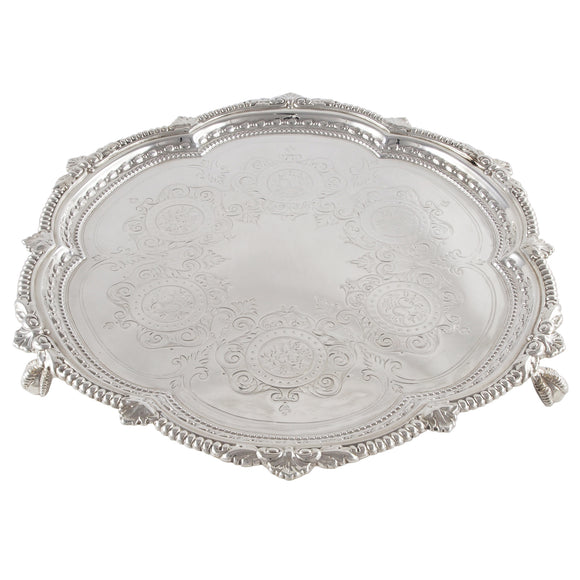 A Victorian, silver, engraved, circular salver on three feet