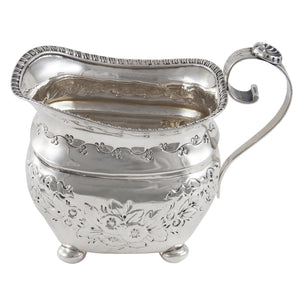 A Victorian, silver, embossed cream jug