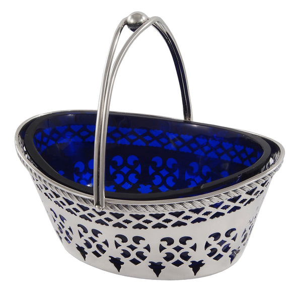 A Victorian, silver, pierced sweet basket & blue glass liner