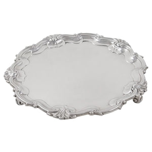 An Edwardian, silver, circular salver on three feet