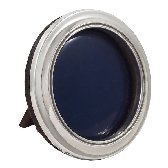 A mid-20th century, silver, miniature, circular photograph frame