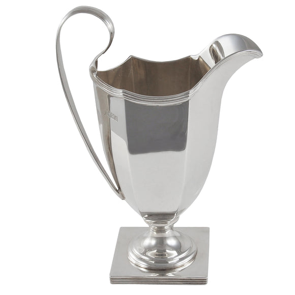 An Edwardian, silver cream jug on a square base