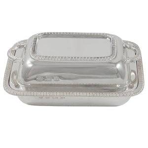 An early 20th century, silver butter dish in the shape of an entrée dish
