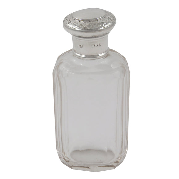 A Victorian, glass bottle with a silver lid