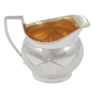 A Victorian, silver cream jug with a gilded interior