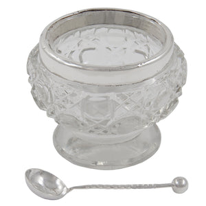 An Edwardian, cut glass open salt with a silver rim & spoon