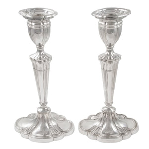 A pair of modern, silver candlesticks