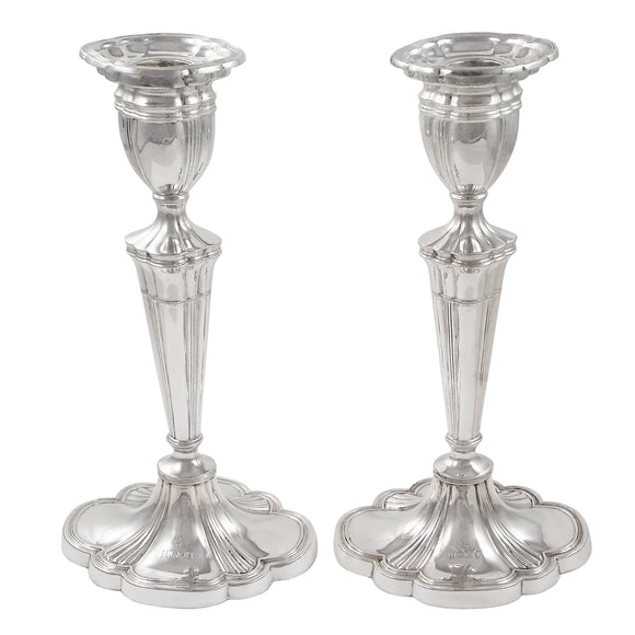 A pair of modern, silver candlesticks