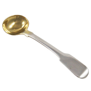 A Georgian, silver salt spoon with a gilt bowl