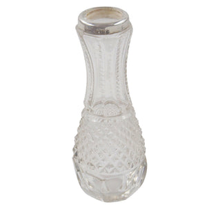 An Edwardian, cut glass bud vase with a silver mount
