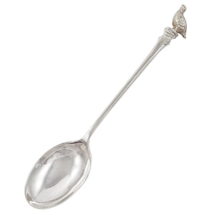 A mid-20th century, silver teaspoon with a partridge model on the terminal end