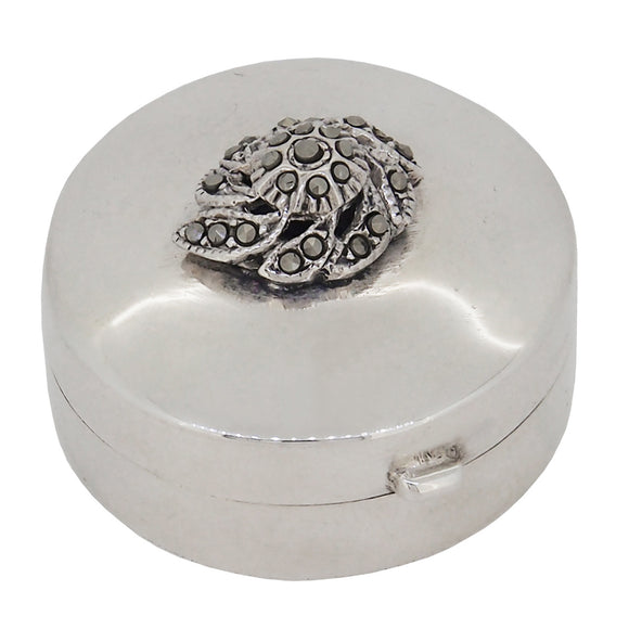 A modern, silver, marcasite set, circular pill box
