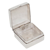 A modern, silver, plain, square pill box