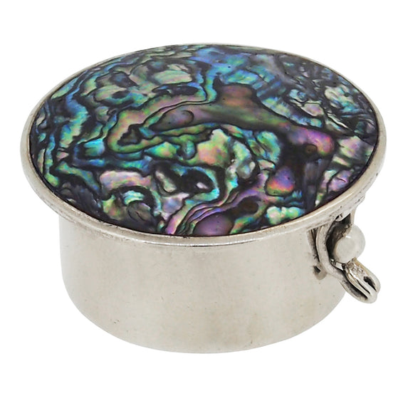 A modern, silver, abalone set, circular pill box