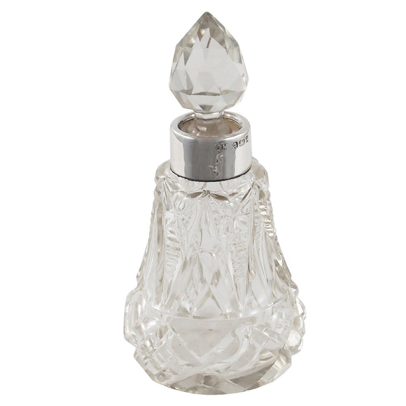An Edwardian, glass scent bottle with a glass stopper & silver mount