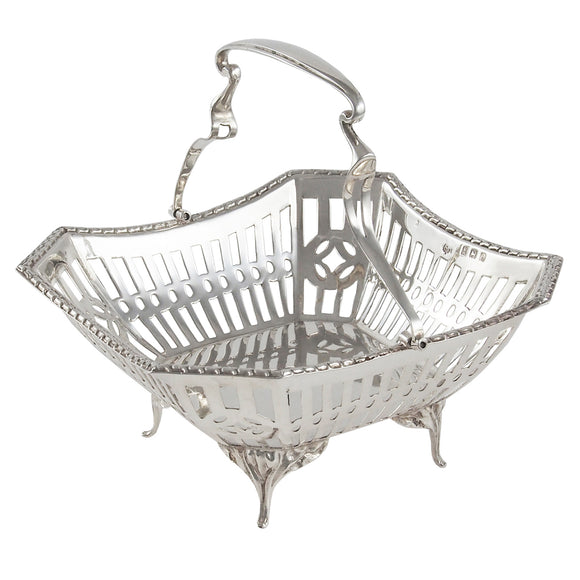 An Edwardian, silver, pierced basket on four feet