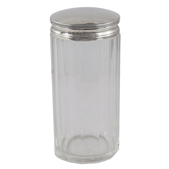 A early 20th century, glass jar with a silver lid