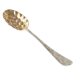 A Georgian, white metal berry teaspoon with a gilt bowl