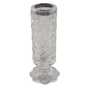 A Victorian, cut glass jar with a silver mount.