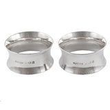 A pair of mid-20th century, silver, plain, concave napkin rings