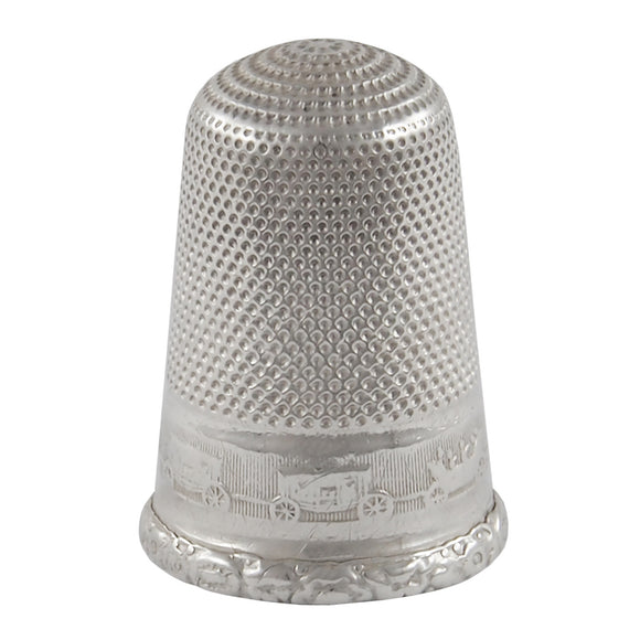 An early 20th century, white metal thimble.