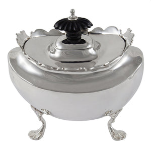 An Edwardian, silver tea caddy on four feet