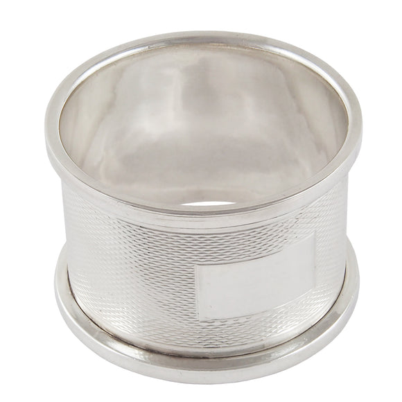 A mid-20th century, silver, engine turned napkin ring