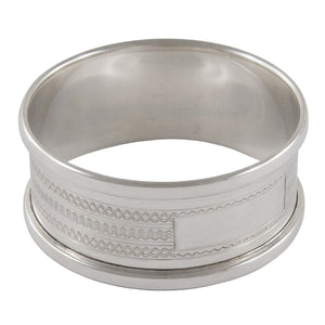 A mid-20th century, silver, engine turned napkin ring.