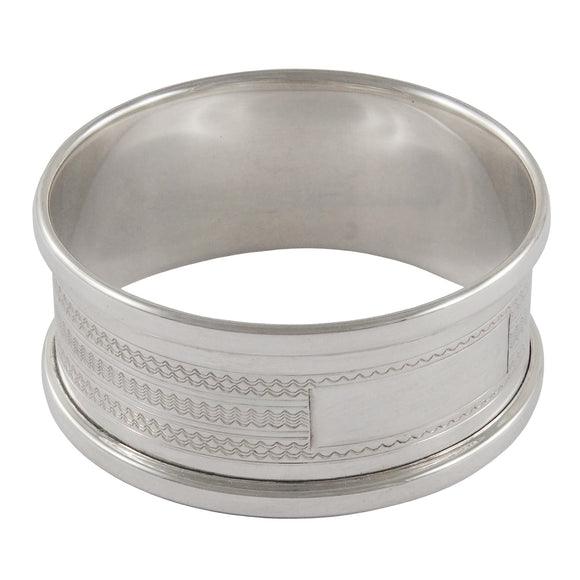 A mid-20th century, silver, engine turned napkin ring.