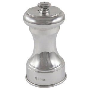 A modern, silver pepper mill.