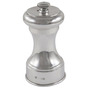 A modern, silver pepper mill.