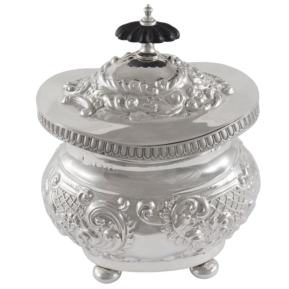 An Edwardian, silver, embossed tea caddy.