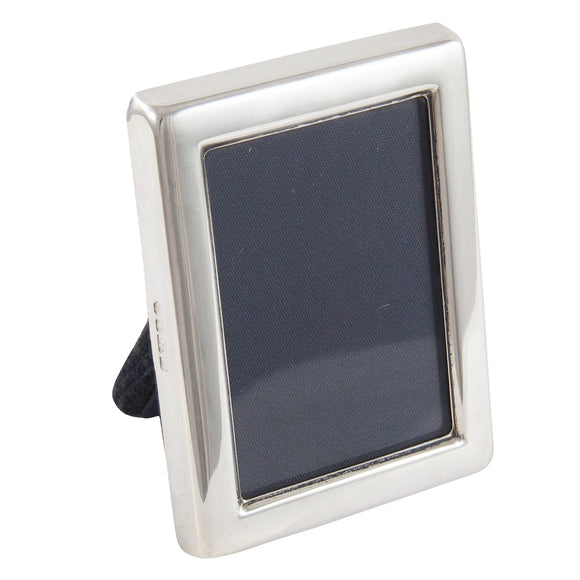 A modern, silver, rectangular photograph frame.